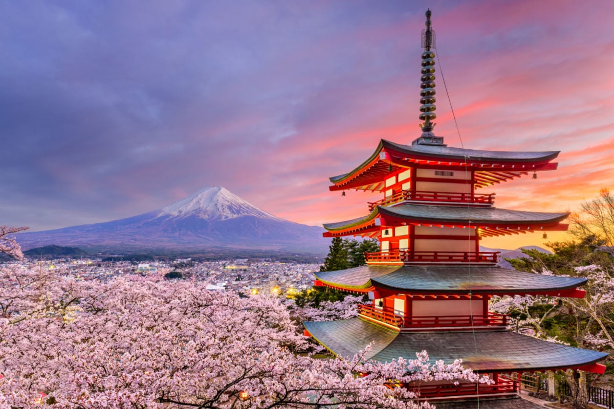 Fujiyoshida, Japan at Chureito Pagoda and Mt. Fuji in the spring with cherry blossoms.